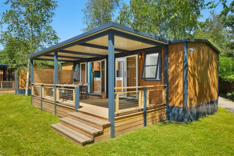 a wooden house with a porch and a porch